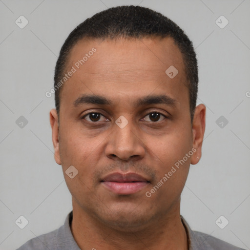 Neutral latino young-adult male with short  black hair and brown eyes