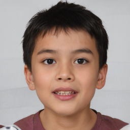 Joyful white child male with short  brown hair and brown eyes