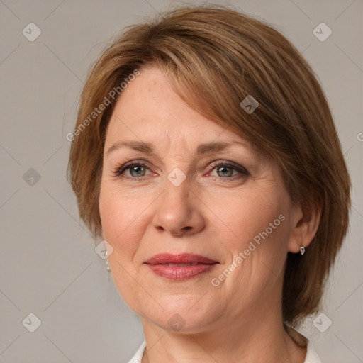 Joyful white adult female with medium  brown hair and grey eyes