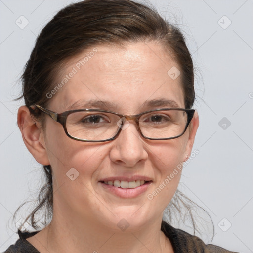 Joyful white adult female with medium  brown hair and grey eyes