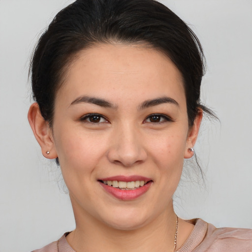 Joyful white young-adult female with medium  brown hair and brown eyes