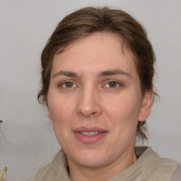 Joyful white adult female with medium  brown hair and brown eyes