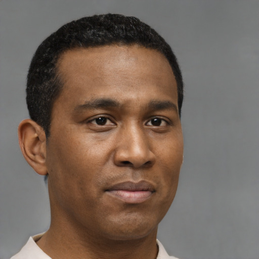 Neutral black young-adult male with short  brown hair and brown eyes
