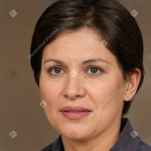 Joyful white adult female with short  brown hair and brown eyes