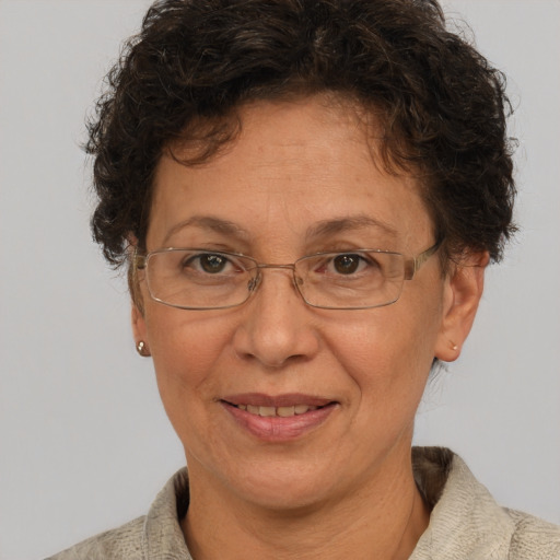 Joyful white middle-aged female with short  brown hair and brown eyes