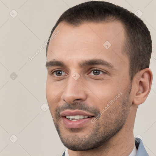 Joyful white young-adult male with short  brown hair and brown eyes