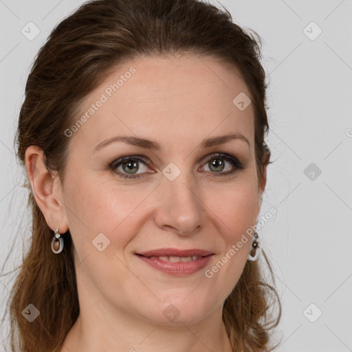 Joyful white adult female with long  brown hair and grey eyes