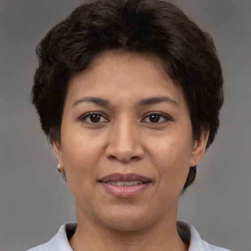 Joyful white adult female with short  brown hair and brown eyes