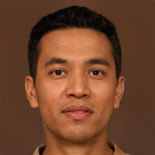 Neutral latino young-adult male with short  brown hair and brown eyes