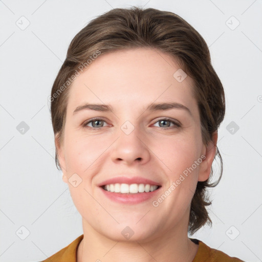 Joyful white young-adult female with medium  brown hair and grey eyes