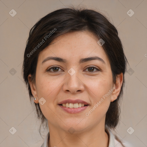 Joyful white adult female with medium  brown hair and brown eyes