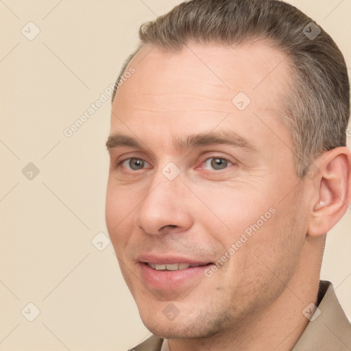 Joyful white adult male with short  brown hair and brown eyes