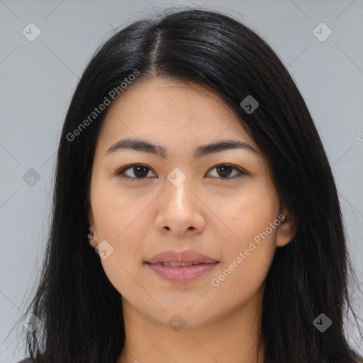 Joyful asian young-adult female with long  brown hair and brown eyes