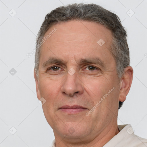 Joyful white middle-aged male with short  brown hair and brown eyes