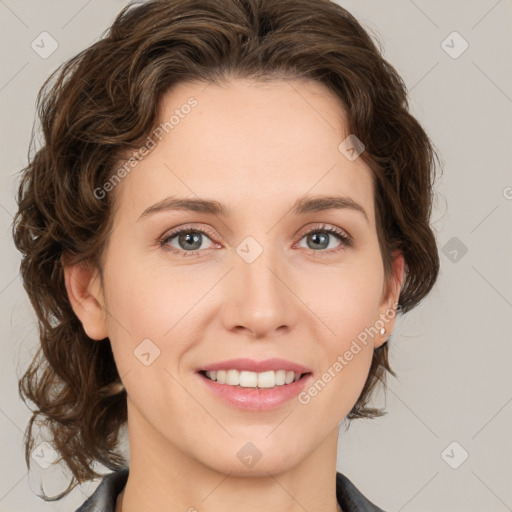 Joyful white young-adult female with medium  brown hair and green eyes