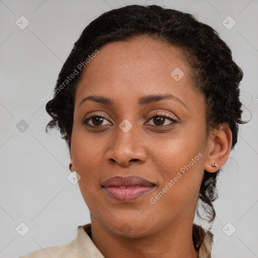 Joyful black adult female with medium  brown hair and brown eyes