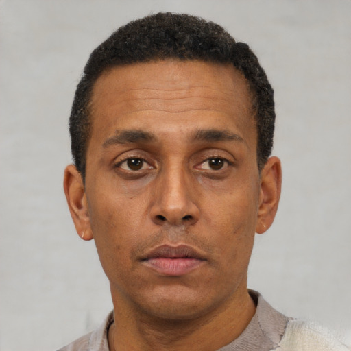 Neutral black adult male with short  brown hair and brown eyes