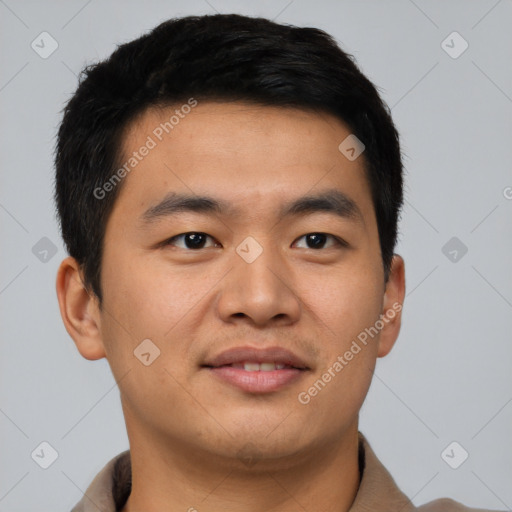 Joyful asian young-adult male with short  black hair and brown eyes