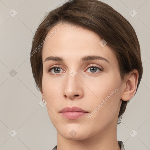 Neutral white young-adult female with short  brown hair and grey eyes