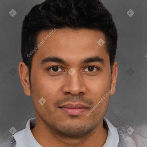 Joyful latino young-adult male with short  brown hair and brown eyes