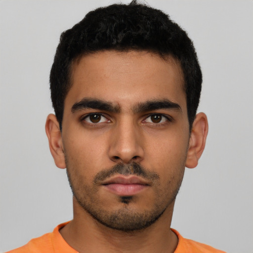 Neutral latino young-adult male with short  black hair and brown eyes