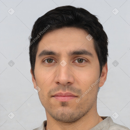 Neutral white young-adult male with short  black hair and brown eyes