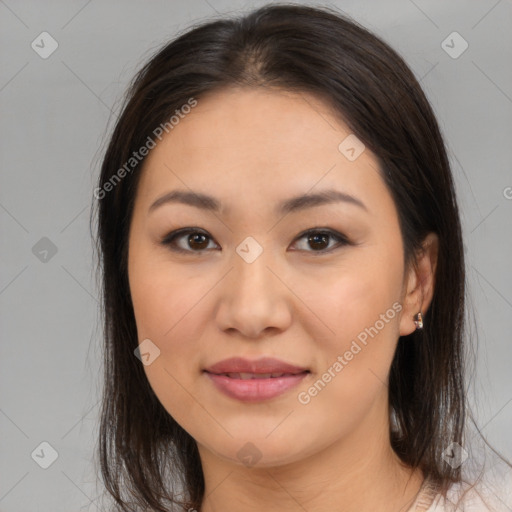 Joyful asian young-adult female with medium  brown hair and brown eyes