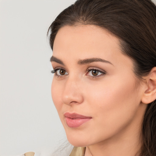 Neutral white young-adult female with long  brown hair and brown eyes