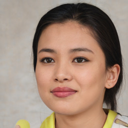 Joyful asian young-adult female with medium  brown hair and brown eyes