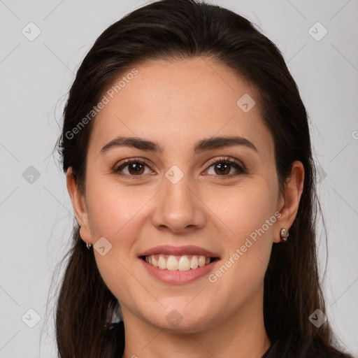 Joyful white young-adult female with long  brown hair and brown eyes