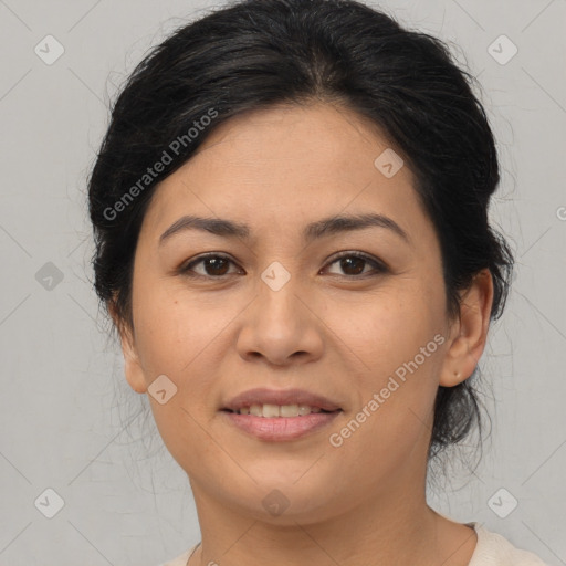 Joyful latino young-adult female with medium  brown hair and brown eyes