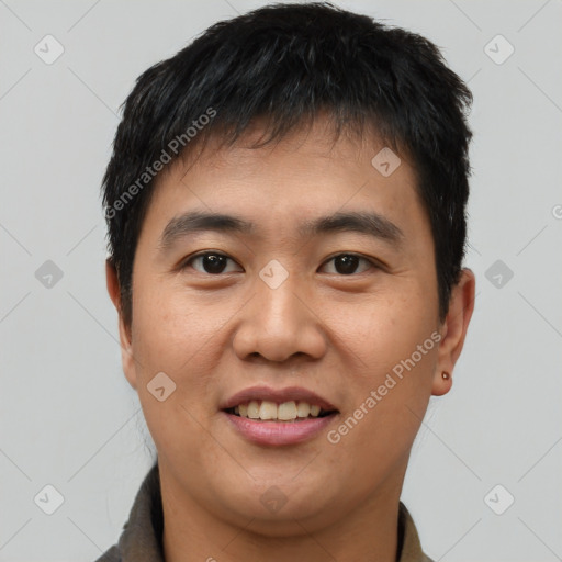 Joyful asian young-adult male with short  black hair and brown eyes