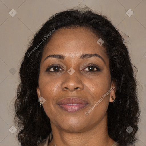 Joyful black adult female with medium  brown hair and brown eyes