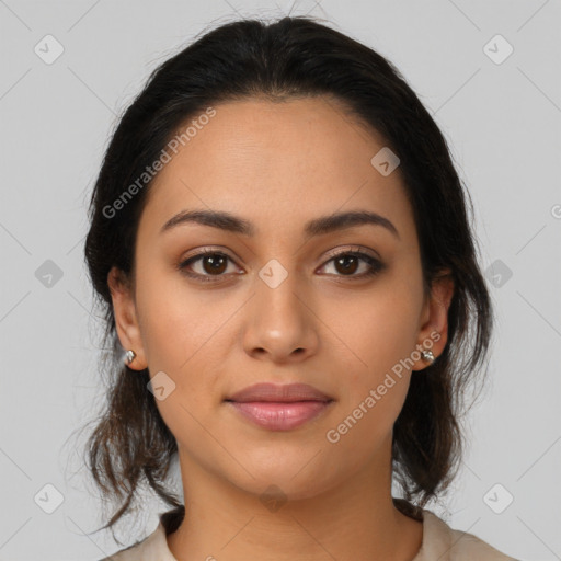 Joyful latino young-adult female with medium  brown hair and brown eyes