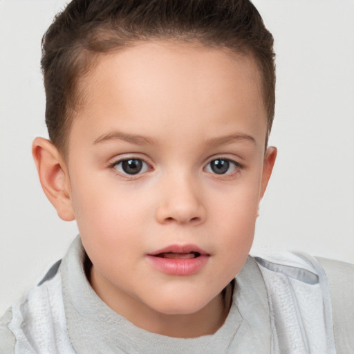 Joyful white child female with short  brown hair and brown eyes