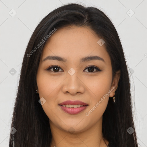 Joyful latino young-adult female with long  brown hair and brown eyes