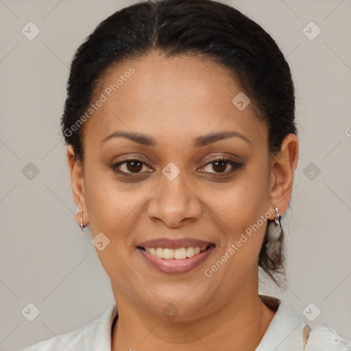 Joyful latino adult female with short  brown hair and brown eyes