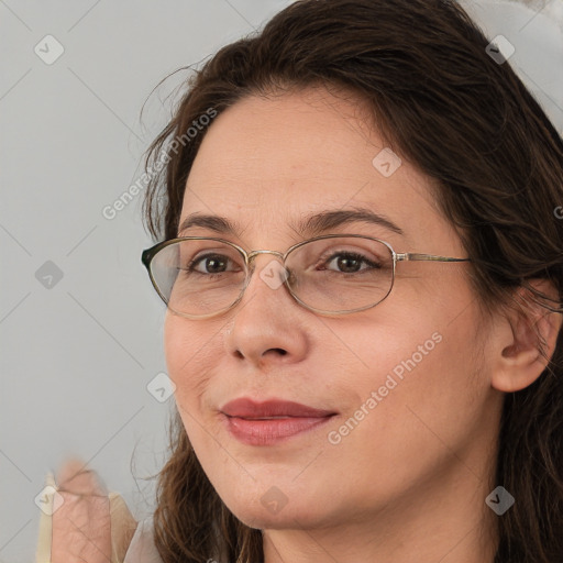 Joyful white adult female with long  brown hair and brown eyes