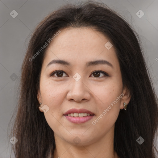 Joyful asian young-adult female with long  brown hair and brown eyes