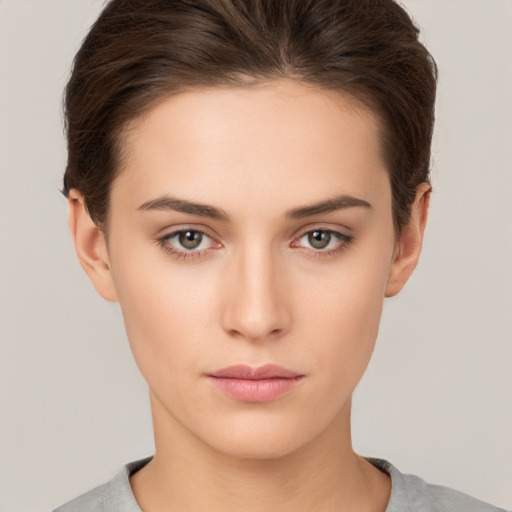 Neutral white young-adult female with short  brown hair and brown eyes