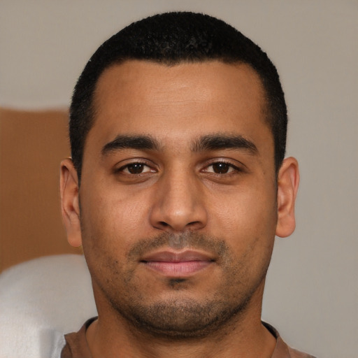 Neutral latino young-adult male with short  black hair and brown eyes