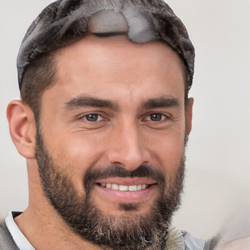 Joyful white adult male with short  brown hair and brown eyes