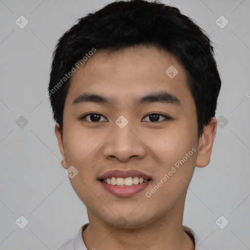 Joyful asian young-adult male with short  black hair and brown eyes