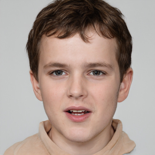 Joyful white child male with short  brown hair and grey eyes