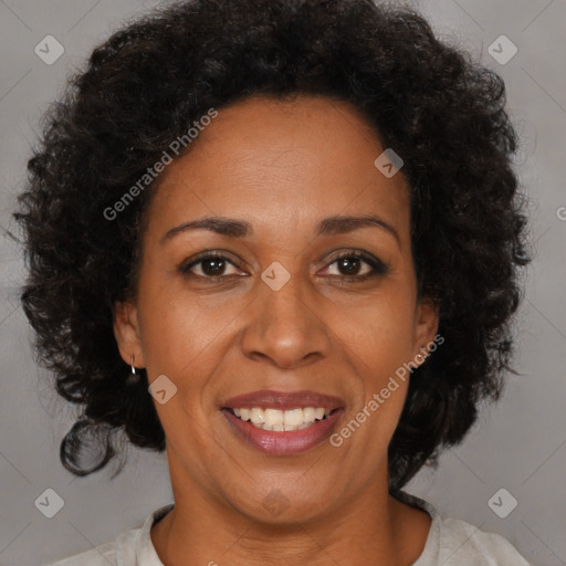 Joyful black adult female with medium  brown hair and brown eyes