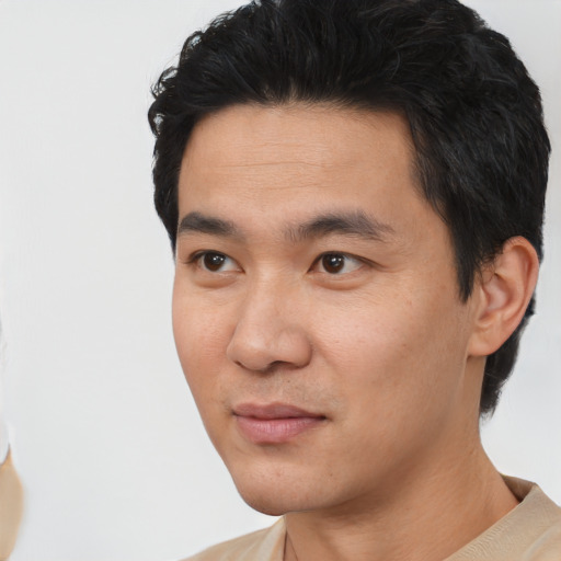 Neutral asian young-adult male with short  black hair and brown eyes