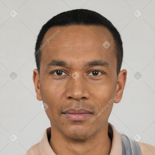 Neutral latino young-adult male with short  black hair and brown eyes