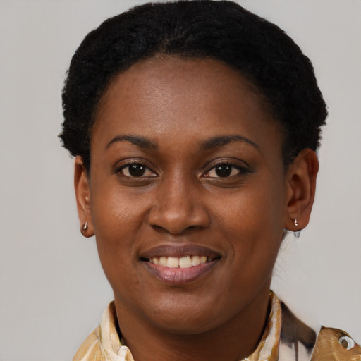 Joyful black young-adult female with medium  brown hair and brown eyes