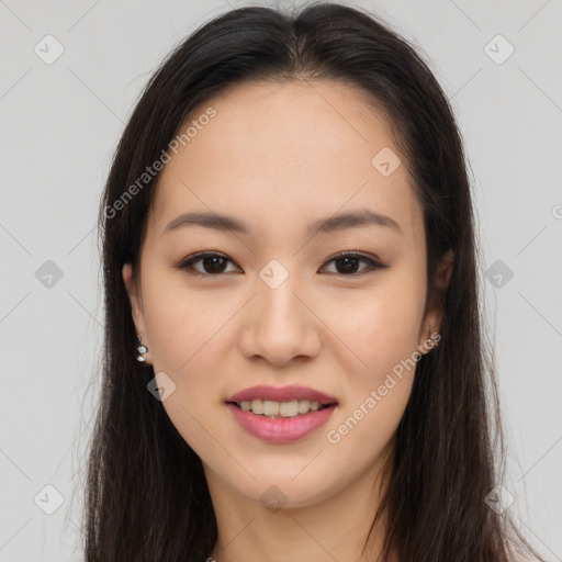 Joyful asian young-adult female with long  brown hair and brown eyes