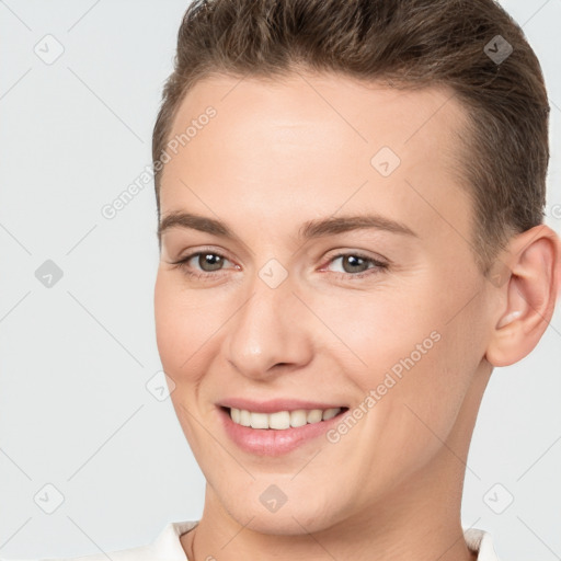 Joyful white young-adult female with short  brown hair and brown eyes